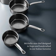 Hestan | Cookware, .75qt Butter Warmer Pan with polished metal handle, designed for precise heat control, shown diagonally, emphasizing its Italian craftsmanship and innovative titanium technology.