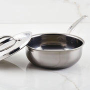 Hestan | Cookware, 2qt Saucier Pan + Lid features a stainless-steel pan with ergonomic handle and lid, showcasing its durable, innovative design for efficient cooking.