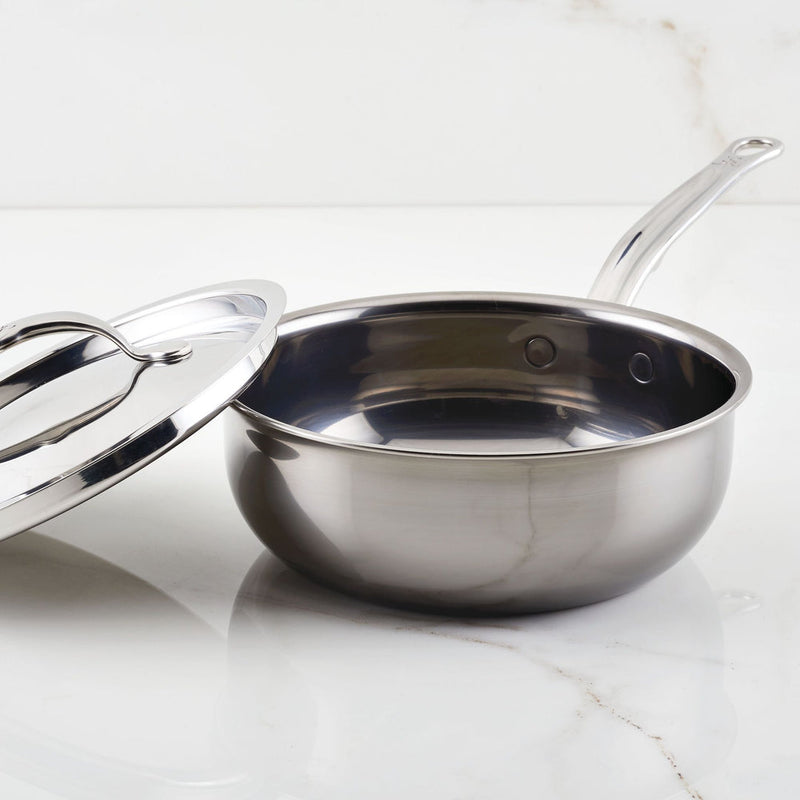 Hestan | Cookware, 2qt Saucier Pan + Lid features a stainless-steel pan with ergonomic handle and lid, showcasing its durable, innovative design for efficient cooking.