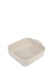 Peugeot | Appolia Square Baking Dish 8 inches, Ecru, featuring a cream ceramic design with rounded corners and small handles, ideal for evenly cooked, healthy recipes.