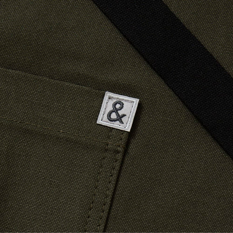 Hedley & Bennett | Cafe Bistro Half Apron - Olive, showcasing a sleek, professional design ideal for chefs and home cooks. Perfect for culinary enthusiasts shopping at Athens Cooks.