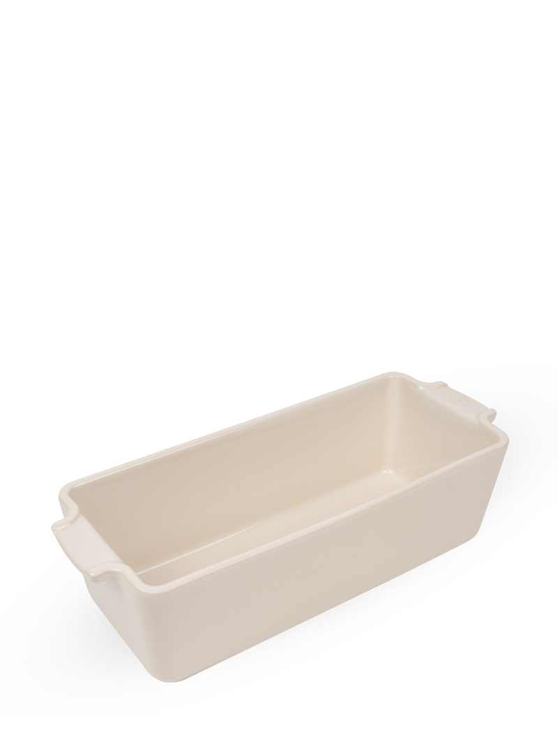 Peugeot | Appolia Loaf Pan: Off-white ceramic baking dish with integrated handles, ideal for bread, meatloaf, or casseroles, perfect for Athens Cooks' curated kitchen collection.