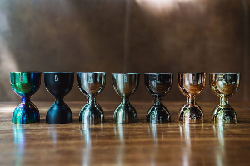 Close-up of Bull in China | Bell Jiggers - Silver, showcasing its ergonomic design and precise internal markings for versatile cocktail measurements.