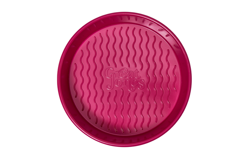 Close-up of Great Jones | Patty Cake - Broccoli's unique wavy, corrugated bottom, designed for easy release and durability in baking.