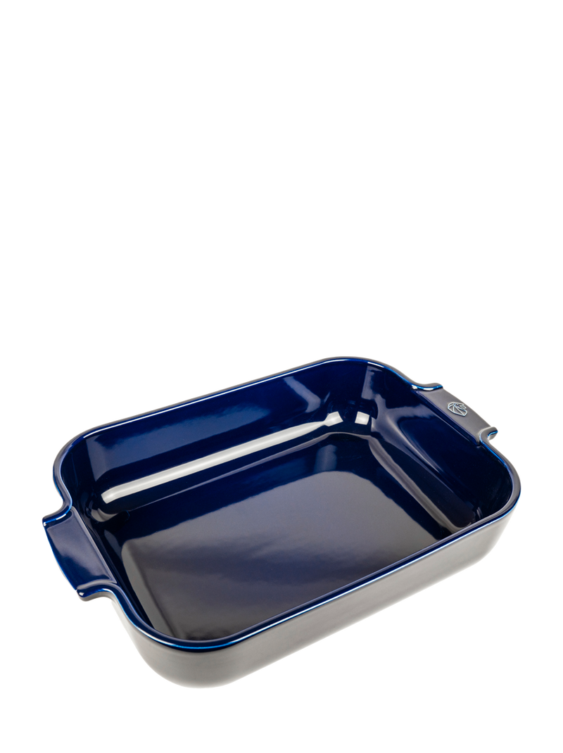 Peugeot | Appolia Baking Dish, Blue: A deep-dish, dark blue ceramic pan with small handles, perfect for baking six to seven servings.