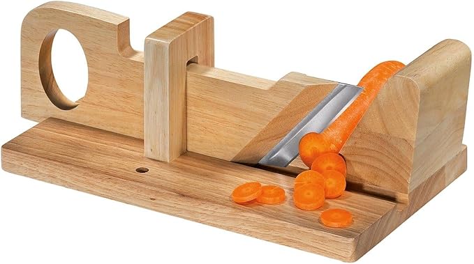 Zassenhaus Charcuterie Slicer slicing a carrot on a wooden surface, showcasing its precision cutting capabilities, ideal for enhancing kitchen efficiency.