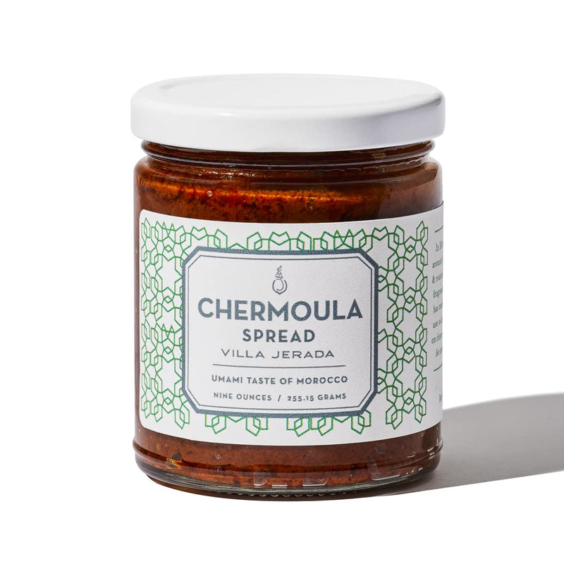 Villa Jerada Chermoula jar with white lid, featuring a label. Aromatic Moroccan spread for meats and vegetables, 9 oz. Ideal for culinary enthusiasts.