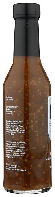 Emily G's Pepper Vinegar Sauce in a glass bottle with a white label and cap, perfect for adding a spicy kick to dishes.