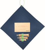 Opinel | Nomad Cooking Kit featuring a beech-wood cutting board and three folding knives, perfect for outdoor meals, showcased on a blue cloth.