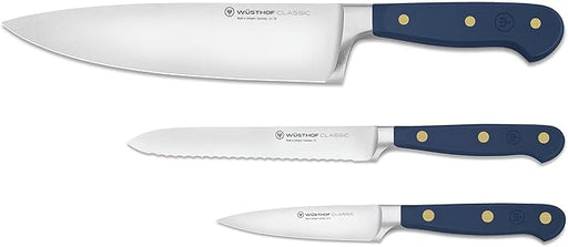 Wüsthof | Classic 3-piece Chef's Set Wild Blueberry features a chef’s knife, serrated utility knife, and paring knife with blue handles and stainless-steel blades.