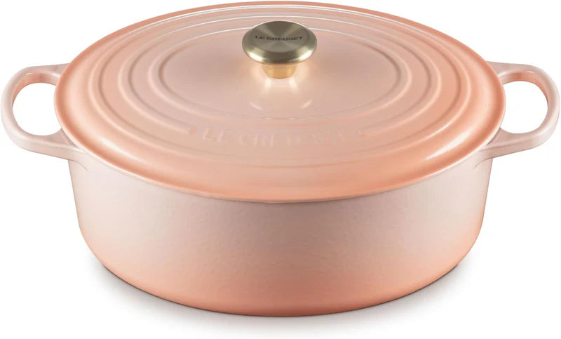 Le Creuset | Signature Chef's Oven: Enameled cast-iron Dutch oven with lid, side handles, and brass-tone knob, ideal for diverse cooking tasks.