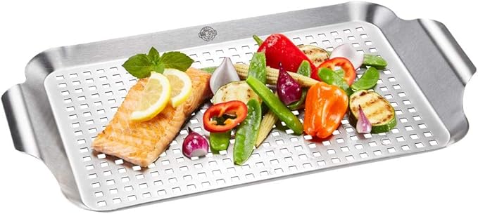 GEFU Large BBQ Grill Pan with salmon, lemon slices, and vegetables, showcasing its versatility for grilling diverse foods.