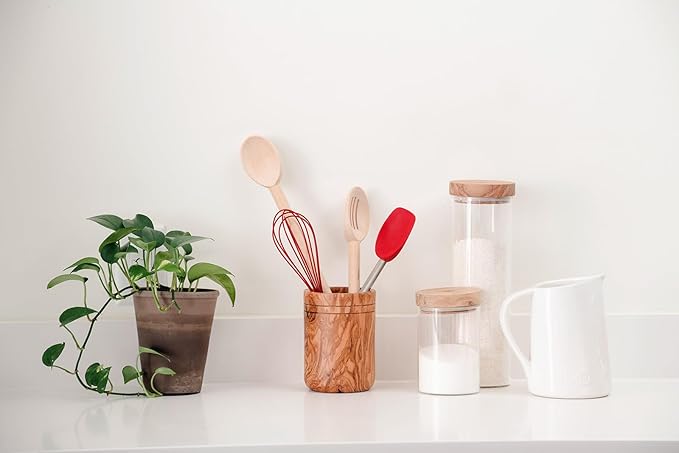 Browne & Co | BERARD Glass Jar with Lid, 4x6 (10x15cm), 20oz (0.6L), displayed with kitchen utensils and a plant on a wooden shelf.