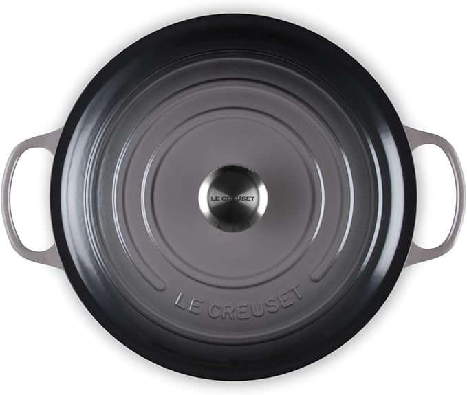 Le Creuset | Signature Round Wide Oven - Oyster, top-down view showing lid with concentric-ring design, side handles, and metal knob, ideal for versatile cooking and serving.