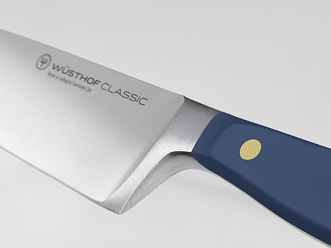 Wüsthof Classic 8 Chef's Knife Wild Blueberry features a sleek blue handle, ideal for precision cutting in kitchen tasks.