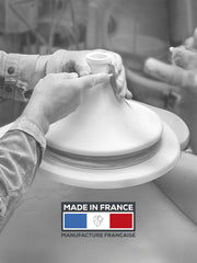 Potter shapes Peugeot | Appolia Atlas Tagine, Saffron Yellow lid, emphasizing its French craftsmanship and innovative design for versatile, healthy cooking at Athens Cooks.