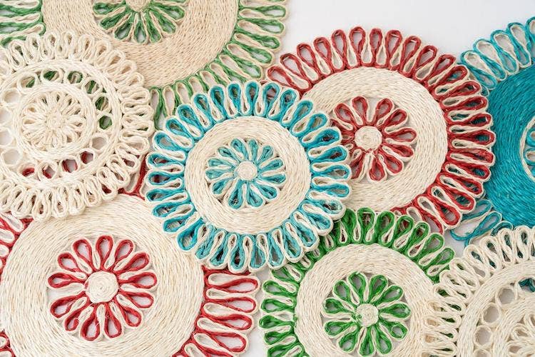NEEPA HUT - Hand Woven Placemat Set | Red and Natural: 16 inches, crafted from heat-resistant seagrass, enhances tabletops with versatile, handcrafted design from Philippine artisans.
