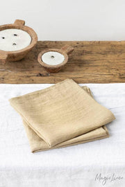 Set of 2 MagicLinen pure linen napkins displayed on a table, highlighting their premium quality and versatility for table decor.