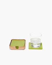 Graf Lantz - Kobon Leather Square Tray - Natural, elegantly designed for organizing small items, shown alongside a glass of water and coaster.