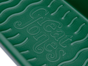 Great Jones | Breadwinner - Raspberry loaf pan with nonstick, nontoxic ceramic coating and unique wavy bottom for easy bread release, showcased in close-up detail.