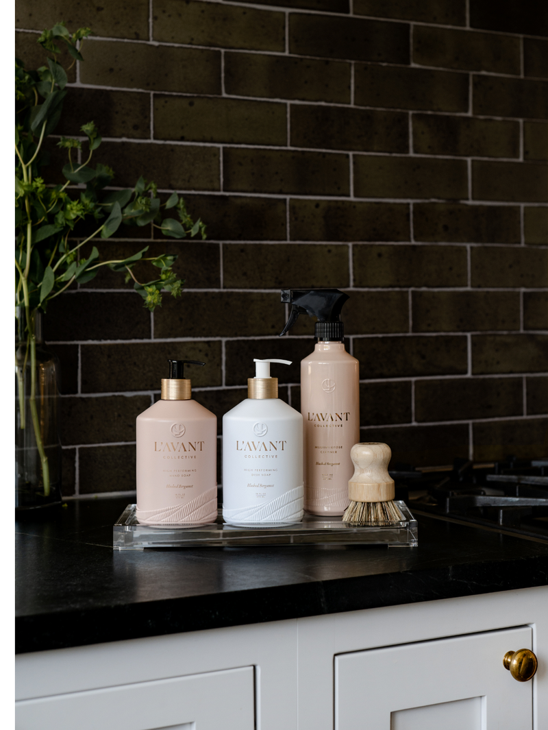 L'AVANT Collective - High Performing Hand Soap - Blushed Bergamot bottles displayed on a kitchen countertop, emphasizing luxury scents and elegant design.