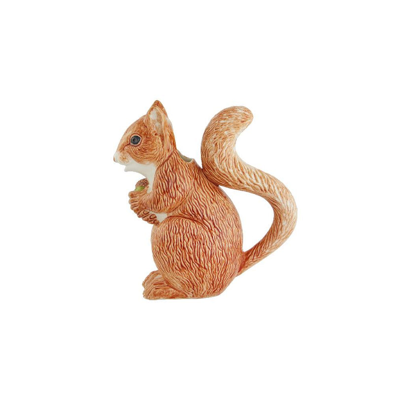 Bordallo Pinheiro Squirrel Pitcher 1.15L: A whimsical orange earthenware pitcher shaped like a squirrel holding an acorn, blending functionality with decorative charm.