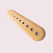 Collin Garrity - Herb Stripper: Walnut, a handmade tool with tapered holes for stripping herbs and scraping seeds.