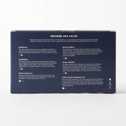 Jacobsen Salt Co. - Infused Sea Salt Gift Set featuring six flavored salts in vials with a wooden stand, perfect for diverse culinary pairings.