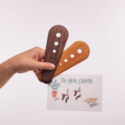 Collin Garrity - Herb Stripper: Cherry and walnut models shown in hand with instructional card, highlighting their use for efficiently stripping herbs and seeds.