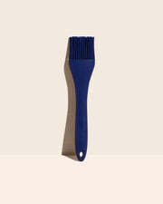 GIR Get It Right - GIR Basting Brush: Navy with dual bristles and comfortable handle for efficient liquid application, displayed on a white surface.