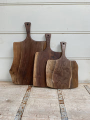 Petermans Boards and Bowls Inc. - 24 black walnut serving board with handle, handcrafted and sustainably sourced, perfect for serving or cutting in any kitchen.