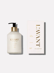 L'AVANT Collective - Fresh Linen Hand Lotion in a sleek glass bottle with black dispenser, accompanied by a matching white box with gold text.