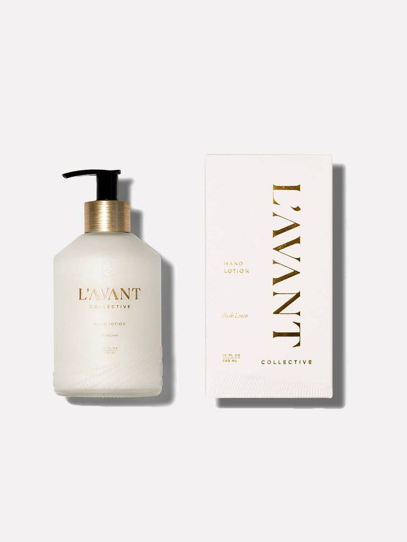 L'AVANT Collective - Fresh Linen Hand Lotion in a sleek glass bottle with black dispenser, accompanied by a matching white box with gold text.