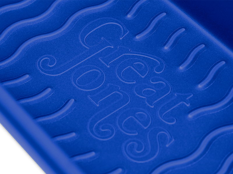 Great Jones | Breadwinner - Raspberry loaf pan with a corrugated, nonstick bottom, designed for easy release of baked goods.