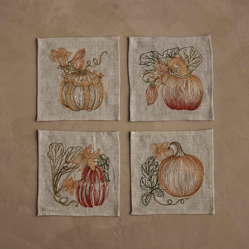 Coral & Tusk - Pumpkin Patch Cocktail Napkin Set: Four embroidered linen-blend napkins with unique pumpkin designs, ideal for enhancing autumnal table settings.