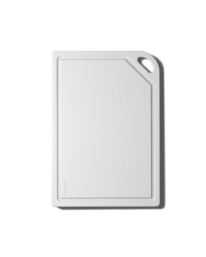 The MK Free Board™️: Cloud, a plant-based cutting board with a juice groove and handle slot, ideal for safe, non-porous chopping, available at Athens Cooks.