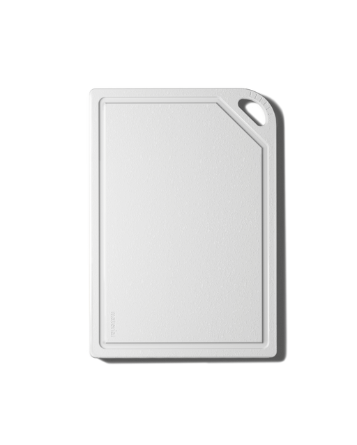 The MK Free Board™️: Cloud, a plant-based cutting board with a juice groove and handle slot, ideal for safe, non-porous chopping, available at Athens Cooks.