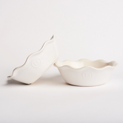 Emile Henry | Modern Classics Mini Pie Dish featuring two white ceramic dishes with scalloped rims and embossed EH emblem, perfect for individual pie servings.