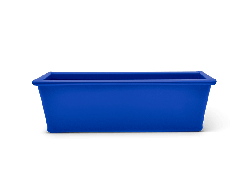 Great Jones | Breadwinner - Raspberry loaf pan with corrugated bottom, designed for nonstick baking and easy release, ideal for ensuring perfect banana bread.