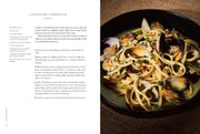 Cookbook spread showing Linguine Vongole recipe from Penguin Random House LLC - Seafood Simple: A Cookbook, highlighting Eric Ripert's accessible seafood techniques for home cooks.