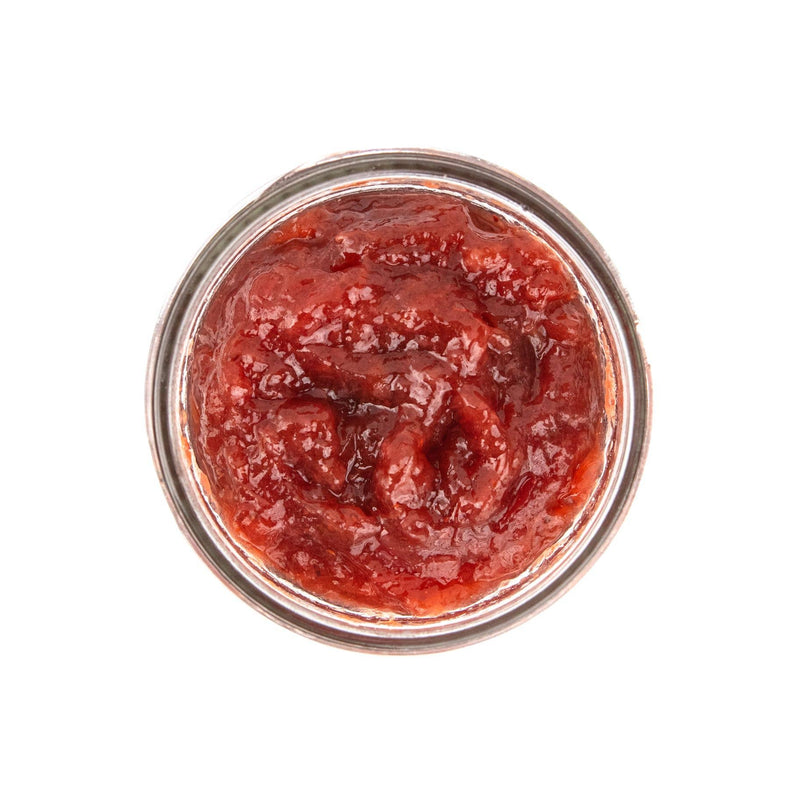 Beth's Farm Kitchen - Strawberry Rhubarb Jam - Low Sugar in a glass jar, showcasing a glossy red paste made from local strawberries and rhubarb.