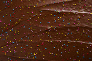 Supernatural - Dye-Free Rainbow Nonpareils Sprinkles, 3oz: A swirl of chocolate ganache topped with multicolored sprinkles, perfect for decorating homemade treats.