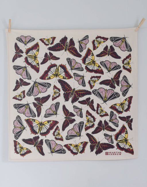 Hearth and Harrow - Butterfly Tea Towel, Organic Cotton, 30x30, featuring stylized butterflies, clipped with clothespins, designed for eco-friendly kitchen use.