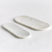Napa Home & Garden - Amal Marble Trays, a pair of sleek oval marble trays perfect for serving cheese and fruit, ideal for elegant kitchen settings.
