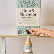 Root and Splendor - Bulk Stain Remover: 18 L carton with spigot dispensing into recycled bottle, labeled “Powerful Clean,” ideal for sustainable, refillable use.