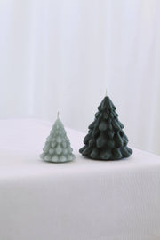 Mo&Co Home Exclusive: Sculpted Beeswax Tree Candles in small and large, designed with layered ridges, evoking holiday nostalgia and contemporary elegance for seasonal decor and gifts.