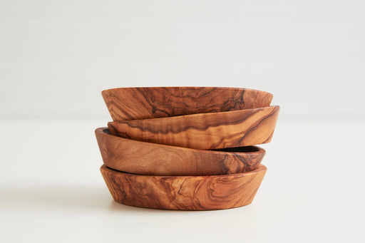 Set of four hand-carved Italian olivewood Aperitivo bowls, showcasing warm natural grain, perfect for appetizers, crafted by artisans in Umbria, Italy.