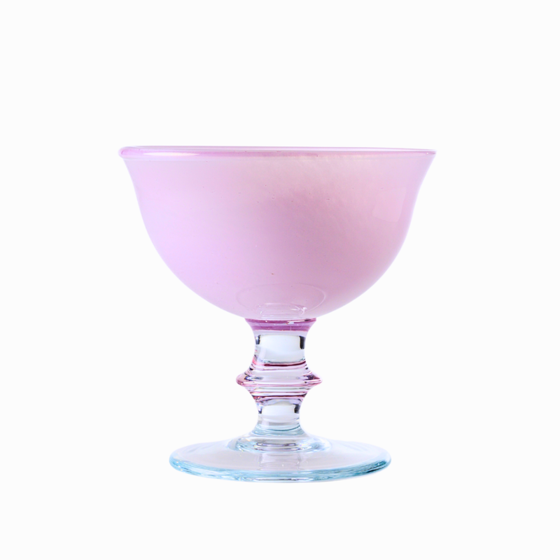 Rialto Compote in Soft Pink by Arte Italica & Crown Linen Designs, showcasing a hand-painted, mouth-blown glass with a clear rim, perfect for elegant table settings.