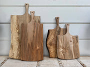 Petermans Boards and Bowls Inc. 27 ambrosia maple serving board with handle, expertly handcrafted for versatile use as a cutting or serving board.