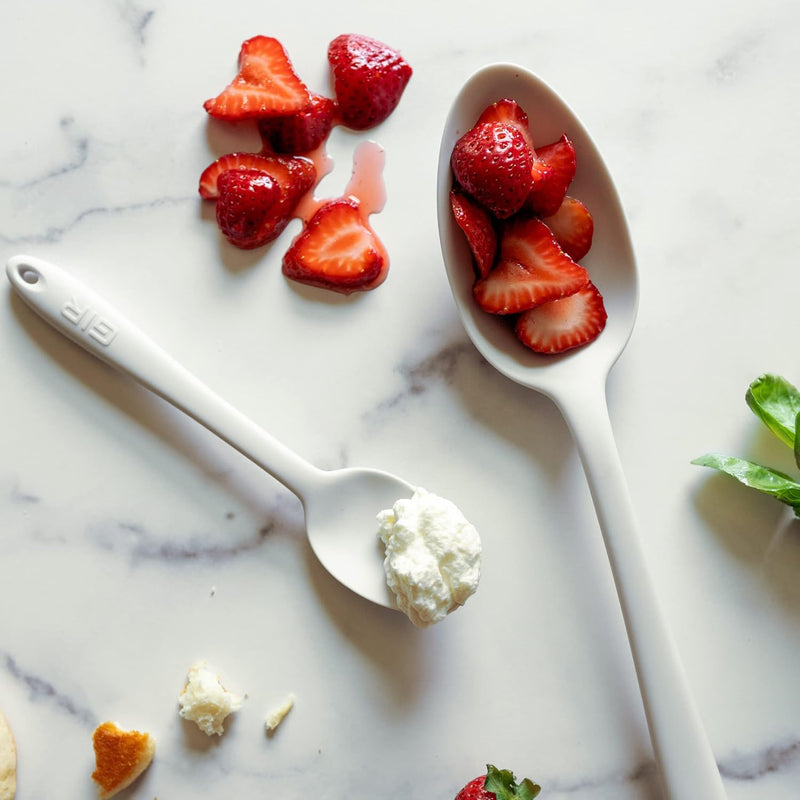 GIR | Ultimate Spoon - Studio White: A versatile kitchen tool with strawberries and cream, ideal for mixing, stirring, scooping, and serving in high-heat cooking.